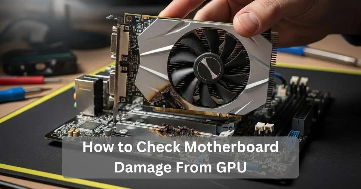 Close-up of a motherboard with a damaged PCIe x16 slot and GPU removed, showing burn marks around the PCIe area.