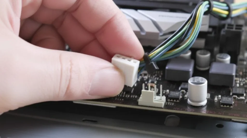 Plugging CPU fan cable into motherboard CPU_FAN header